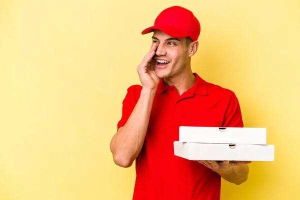 Young Delivery Caucasian Man Holding Pizzas Isolated Yellow Background Saying — ストック写真