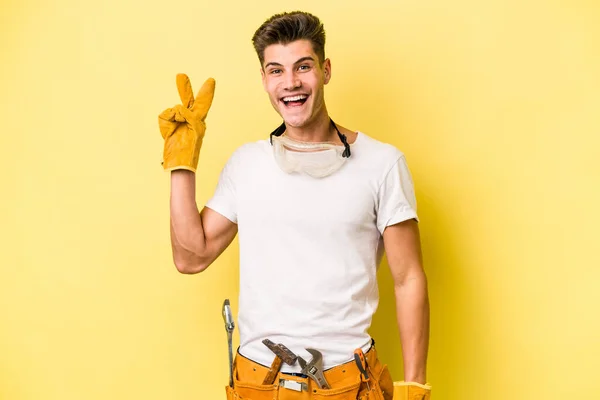 Young Electrician Caucasian Man Isolated Yellow Background Joyful Carefree Showing — Fotografia de Stock
