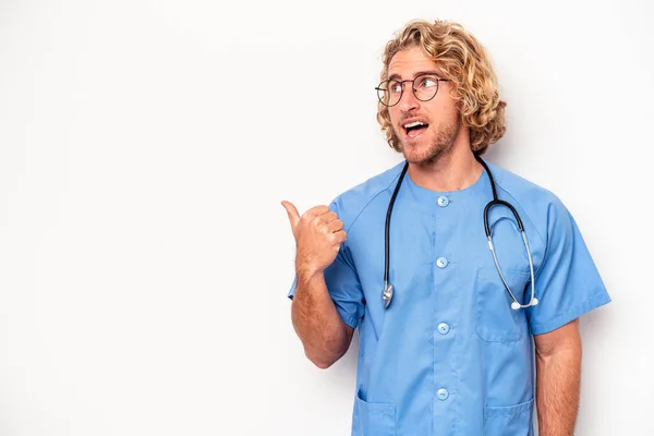Young Nurse Caucasian Man Isolated White Background Points Thumb Finger — Stock Photo, Image