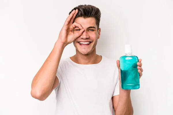 Young Caucasian Man Holding Mouthwash Isolated White Background Excited Keeping — Stock fotografie