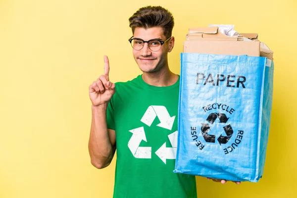 Young Caucasian Man Holding Recycling Bag Full Paper Recycle Isolated — Stockfoto