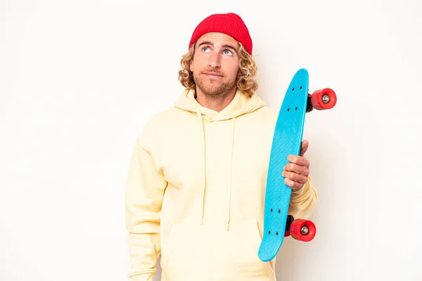 Young Skater Caucasian Man Isolated White Background Dreaming Achieving Goals — Stok fotoğraf