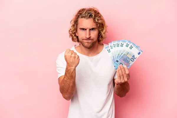 Young Caucasian Man Holding Banknotes Isolated Pink Background Showing Fist — Stockfoto