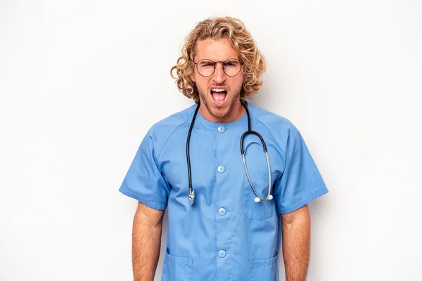 Young Nurse Caucasian Man Isolated White Background Screaming Very Angry — Stock Photo, Image