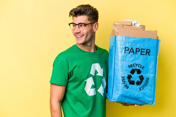 Young Caucasian Man Holding Recycling Bag Full Paper Recycle Isolated — Stockfoto