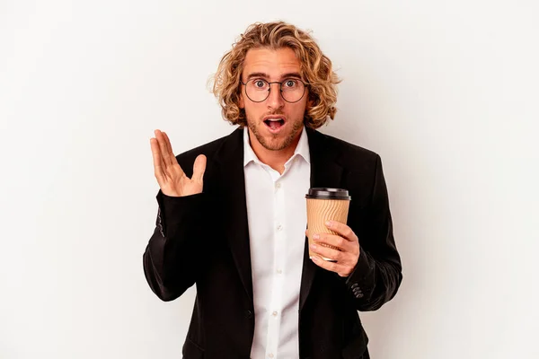 Young Caucasian Business Man Holding Coffee Isolated White Background Surprised — Stockfoto