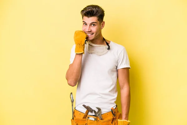 Young Electrician Caucasian Man Isolated Yellow Background Biting Fingernails Nervous — Fotografia de Stock