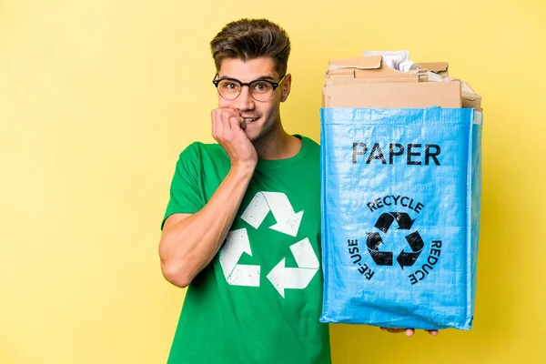 Young Caucasian Man Holding Recycling Bag Full Paper Recycle Isolated — Stock fotografie