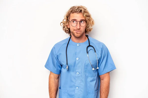 Young Nurse Caucasian Man Isolated White Background Confused Feels Doubtful — Stockfoto