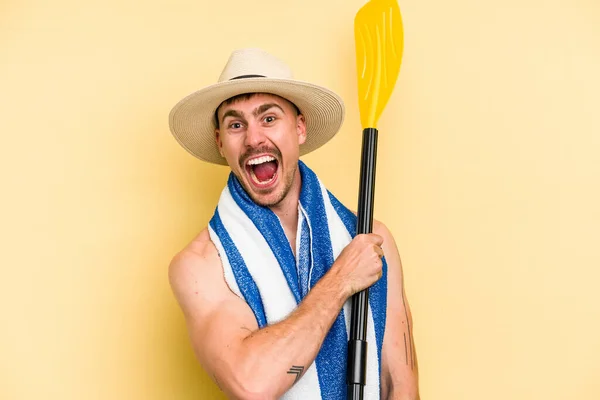 Young Caucasian Man Holding Rowing Stick Isolated Yellow Background — Photo