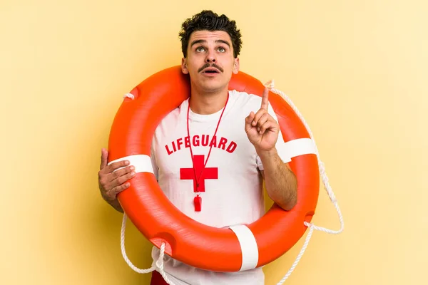 Young Caucasian Lifeguard Man Isolated Yellow Background Pointing Upside Opened — 图库照片