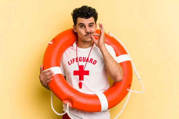 Young Caucasian Lifeguard Man Isolated Yellow Background Fingers Lips Keeping — Foto de Stock