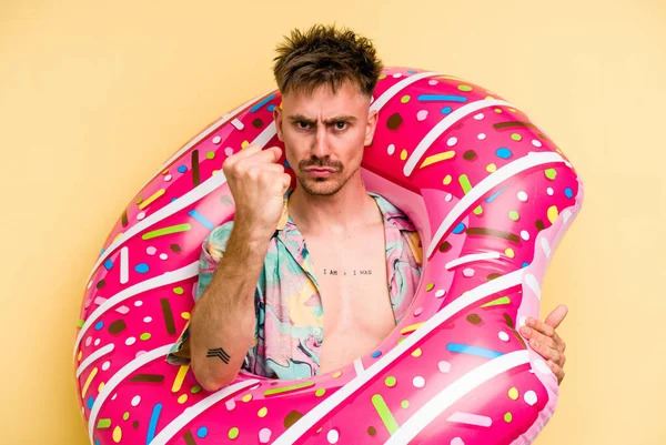 Young Caucasian Man Holding Inflatable Donut Isolated Yellow Background Showing — 图库照片