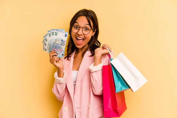 Young Hispanic Woman Holding Shopping Bag Isolated Yellow Background — Foto de Stock