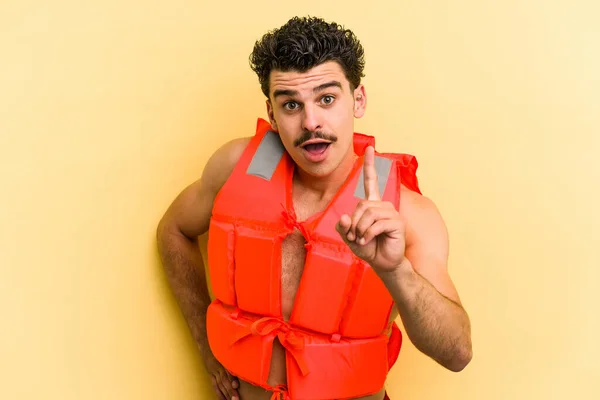 Young Caucasian Man Wearing Life Jacket Isolated Yellow Background Having — 图库照片