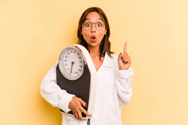Young Nutritionist Woman Holding Weighing Machine Isolated Yellow Background Having — Stock Photo, Image