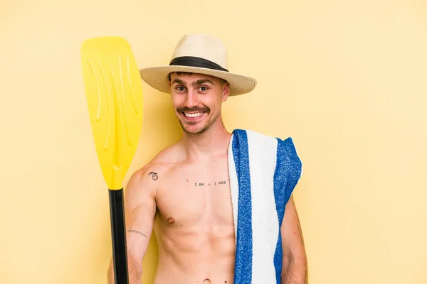 Young Caucasian Man Holding Rowing Stick Isolated Yellow Background — Stockfoto