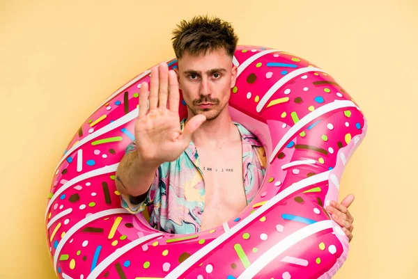 Young Caucasian Man Holding Inflatable Donut Isolated Yellow Background Standing — 图库照片