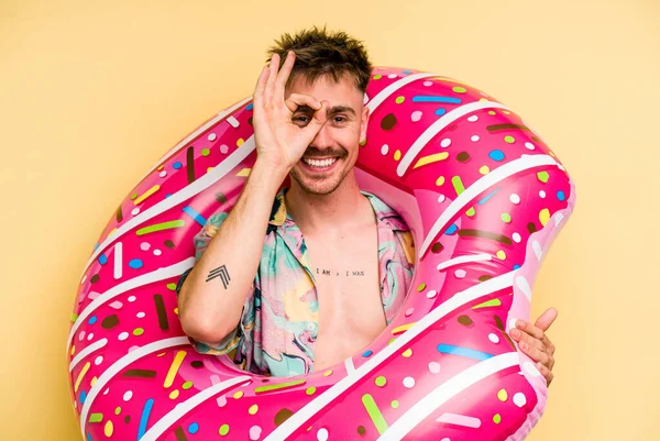 Young Caucasian Man Holding Inflatable Donut Isolated Yellow Background Excited — 图库照片