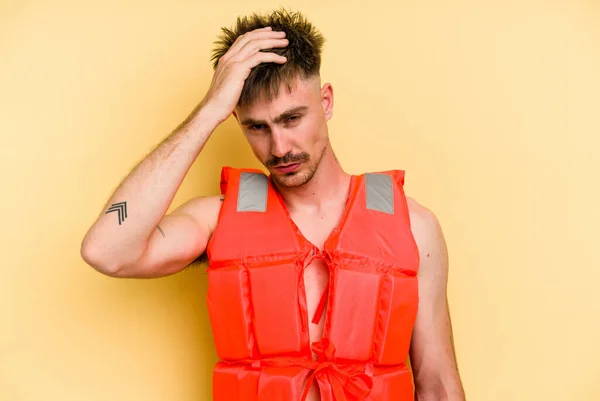 Young Caucasian Man Wearing Life Jacket Isolated Yellow Background Being — Stock Photo, Image