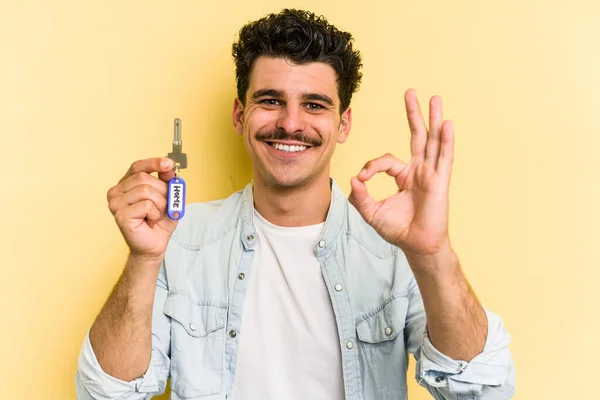 Young Caucasian Man Holding Home Keys Isolated Yellow Background Cheerful — Stock fotografie