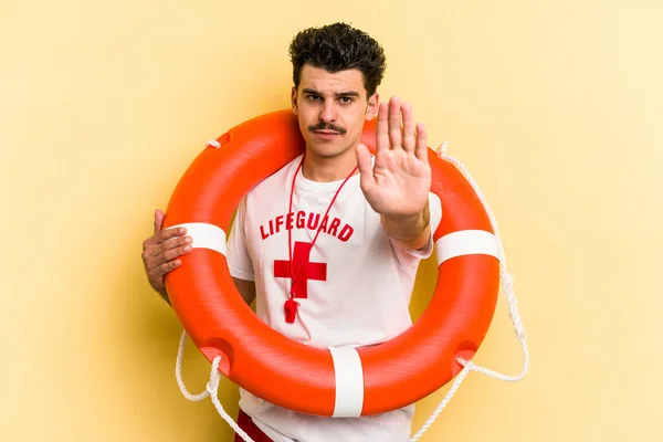 Young Caucasian Lifeguard Man Isolated Yellow Background Standing Outstretched Hand — 图库照片