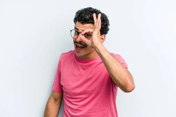 Young Caucasian Man Isolated Blue Background Excited Keeping Gesture Eye — Stock Photo, Image