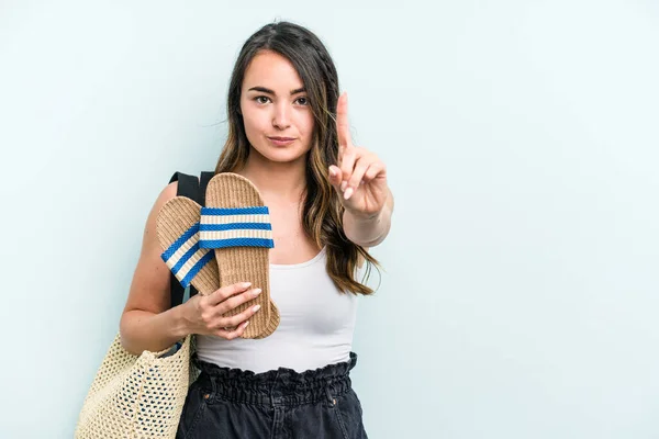 Young Caucasian Woman Holding Sandals Isolated Blue Background Showing Number — Photo