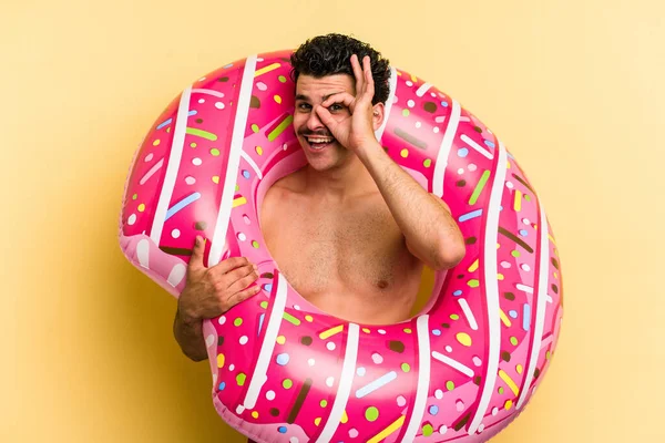 Young Caucasian Man Holding Inflatable Donut Isolated Yellow Background Excited — 图库照片