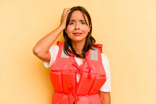 Young Hispanic Woman Holding Life Jacket Isolated Yellow Background Being — Stock Photo, Image