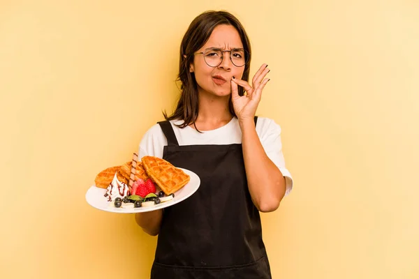 Young Hispanic Dependent Woman Holding Waffles Isolated Yellow Background Fingers — Stock Photo, Image