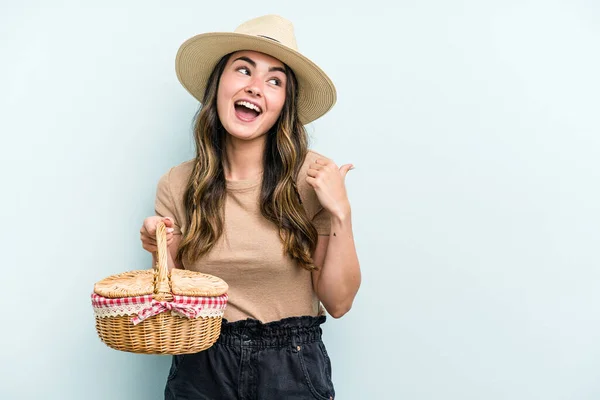 Young Caucasian Woman Holding Picnic Basket Isolated Blue Background Points — Foto Stock