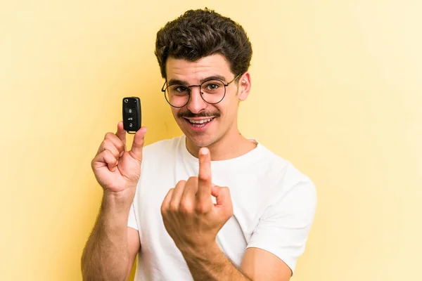 Young Caucasian Man Holding Car Keys Isolated Yellow Background Pointing — Foto Stock
