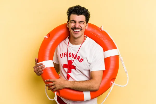 Young Caucasian Lifeguard Man Isolated Yellow Background Laughing Having Fun — ストック写真