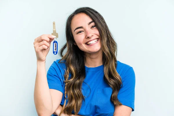 Young Caucasian Woman Holding Home Keys Isolated Blue Background Laughing — Foto de Stock