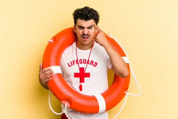 Young Caucasian Lifeguard Man Isolated Yellow Background Showing Disappointment Gesture — ストック写真