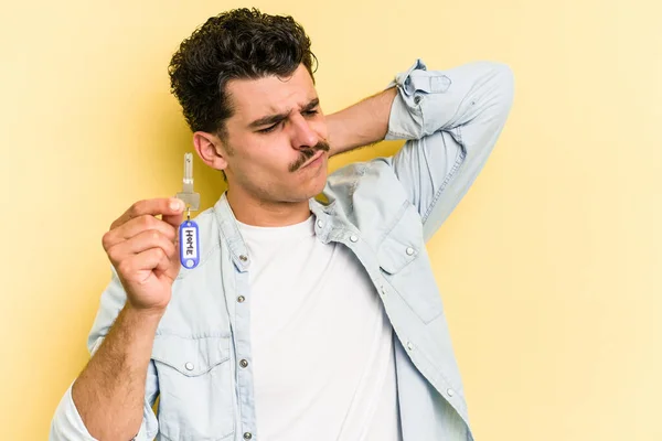 Young Caucasian Man Holding Home Keys Isolated Yellow Background Touching — 图库照片