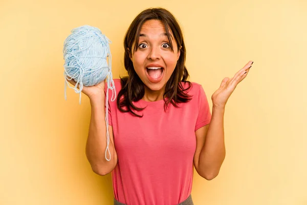 Young Hispanic Woman Holding Ball Wool Isolated Yellow Background Receiving — Stock Photo, Image
