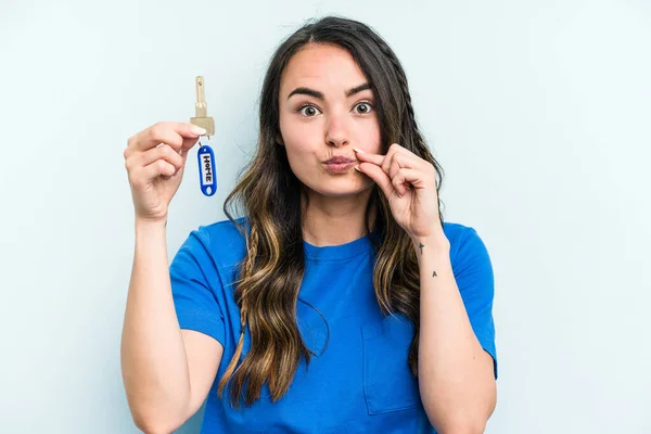 Young Caucasian Woman Holding Home Keys Isolated Blue Background Fingers — Stock fotografie