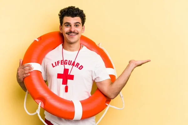 Young Caucasian Lifeguard Man Isolated Yellow Background Showing Copy Space — ストック写真