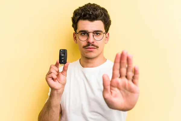 Young Caucasian Man Holding Car Keys Isolated Yellow Background Standing — Foto Stock