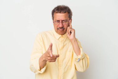 Middle aged indian man isolated on white background pointing temple with finger, thinking, focused on a task.