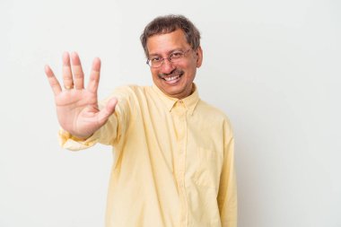Middle aged indian man isolated on white background smiling cheerful showing number five with fingers.