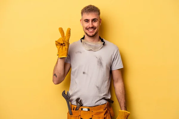 Young Electrician Caucasian Man Isolated Yellow Background Showing Number Two — Zdjęcie stockowe