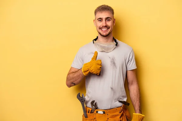 Young Electrician Caucasian Man Isolated Yellow Background Smiling Raising Thumb — Stock Fotó