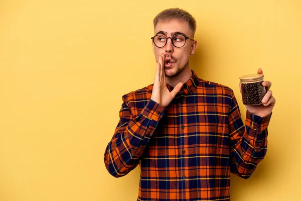 Young Caucasian Man Holding Coffee Jar Isolated Yellow Background Saying — Stockfoto
