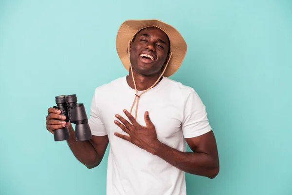 Young African American Man Holding Binoculars Isolated Blue Background Laughs — ストック写真