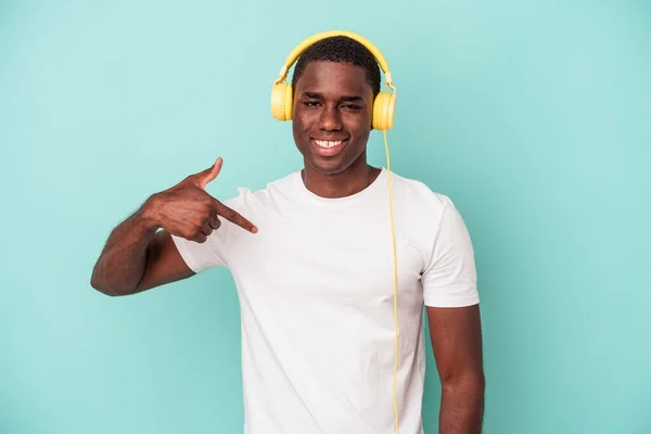 Young African American Man Listening Music Isolated Blue Background Person — ストック写真