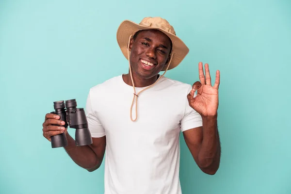Young African American Man Holding Binoculars Isolated Blue Background Cheerful — ストック写真