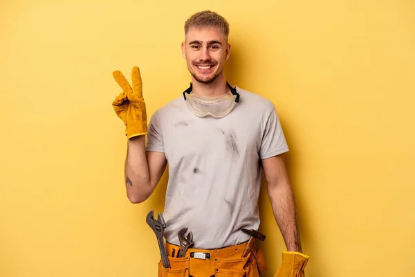 Young Electrician Caucasian Man Isolated Yellow Background Joyful Carefree Showing — Zdjęcie stockowe